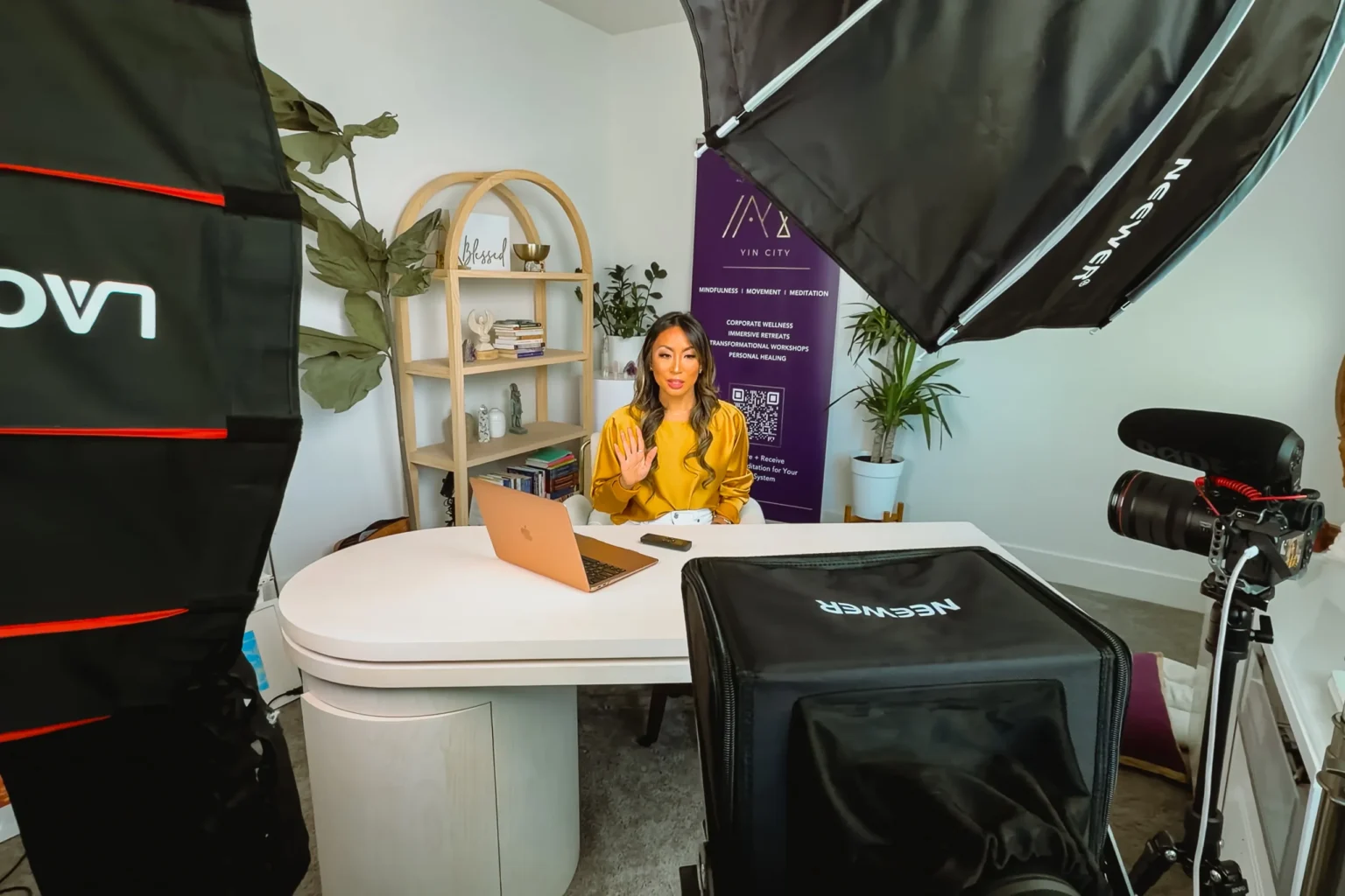 Envision Studios Referral Program | Envision Studios Envision Studios videographer filming branded content on a lit studio set