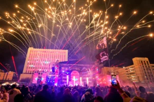 Envision Studios Referral Program | Envision Studios Live concert stage with pyrotechnics and LED screens during event coverage